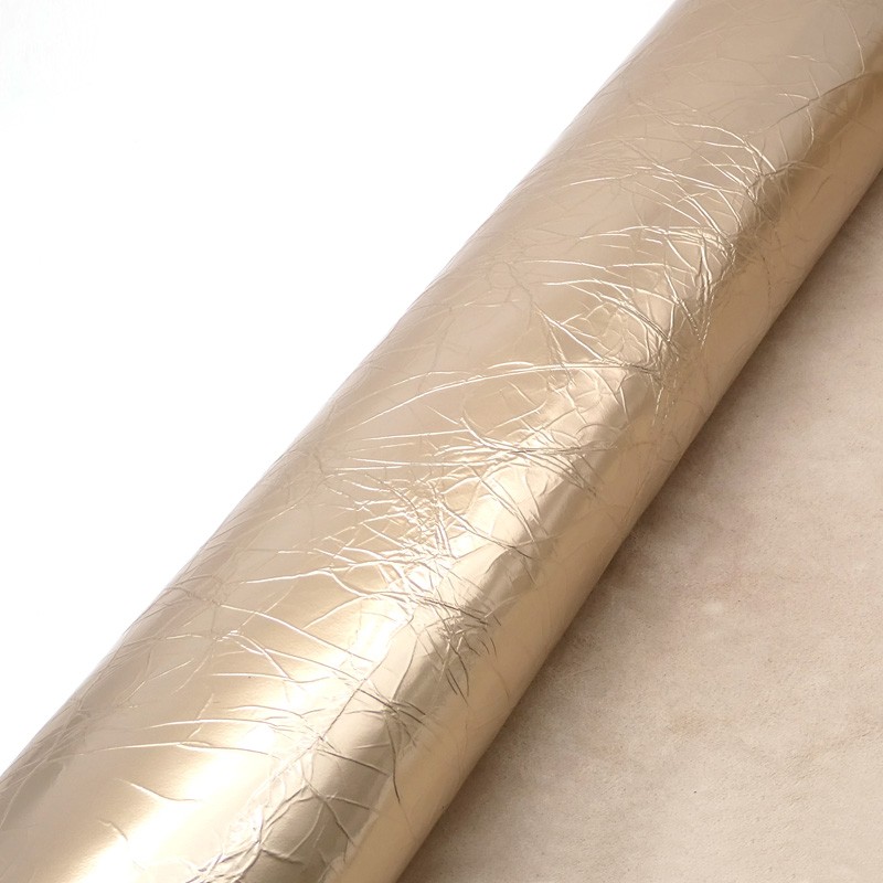 Peau de chèvre Fantaisie. Cuir métallisé. Teinte Or blanc plissé